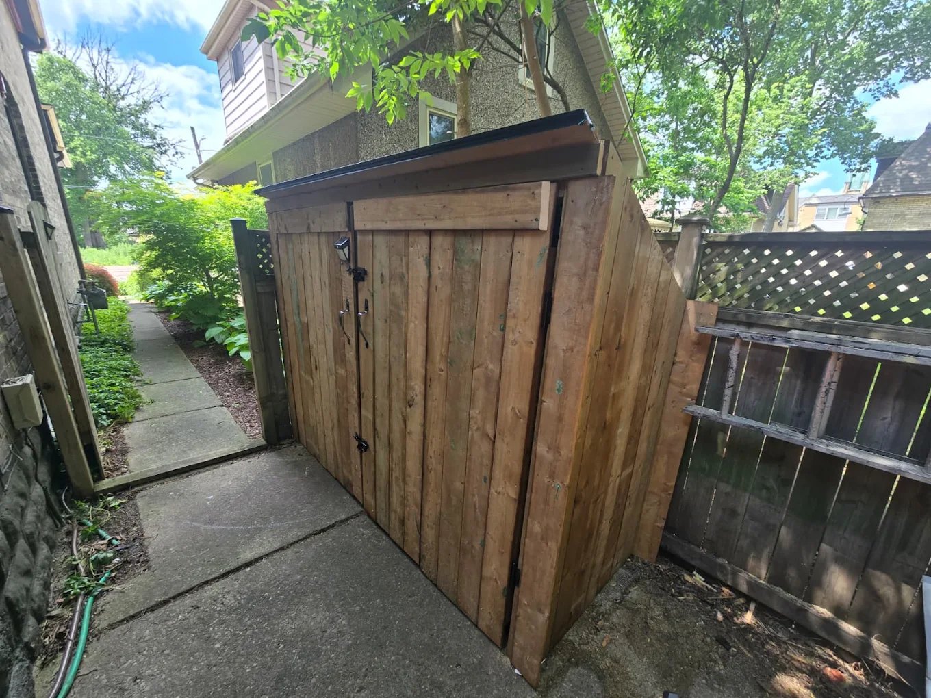 Garbage bin storage enclosure